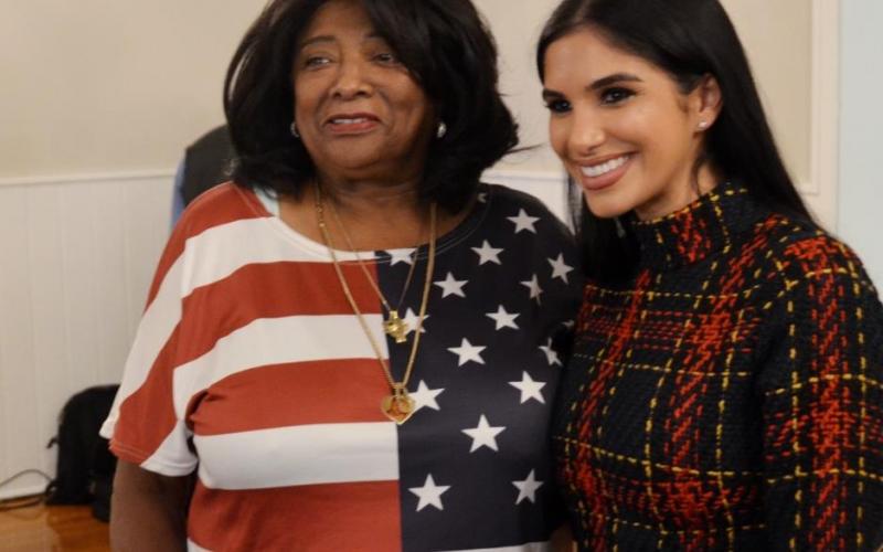 A patriotic American citizen chats with Ms. Gesiotto (right)